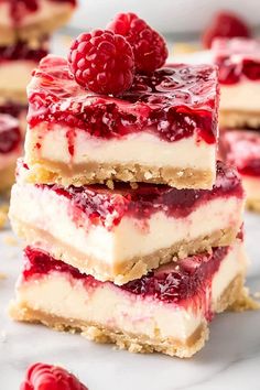 raspberry cheesecake bars stacked on top of each other