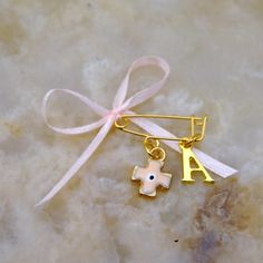 Set of 10 personalized witness pins for boys and girls.A enameled cross with evil eye and a handmade bow are attached on the gold plated pin.There is also an initial letter that you can choose from the drop down menu.The initial letters you can chose are from the Greek alphabet. A beautiful keepsake for your guests and the event will be in their mind for long. The favors are packed all together in a hard paper box, ready to offer to your guests. The listing is for 10 pieces If you want any custo Personalized White Pins For Gifts, Enamel Cross, Alphabet A, Greek Alphabet, Handmade Bows, Initial Letter, Initial Letters, Paper Box, Evil Eye