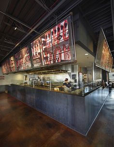 the inside of a restaurant with menus on the wall