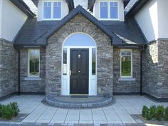 a large house with a black front door