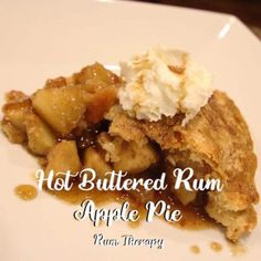 a white plate topped with apple pie and whipped cream