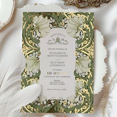 Embrace timeless elegance with our wedding invitations featuring the renowned Pimpernel pattern by William Morris, masterfully rendered in vintage hues of sage green, cool white, and accented with gold foil. William Morris, a figurehead of the Arts and Crafts Movement, believed in the beauty of handcrafted designs and the harmonious interaction of color and pattern. His iconic Pimpernel pattern, characterized by its entwining foliage and delicate florals, has endured through the decades, embodyi Wedding Invitation Sage Green, William Morris Wedding, Traditional Wedding Invitations, Foil Wedding Invitations, Foil Invitations, Vintage Wedding Invitations, Formal Invitation, Arts And Crafts Movement, Elegant Wedding Invitations