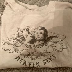 Not Cropped But Not Oversized Brandy Melville Heaven Sent T-Shirt Never Worn White Print Crew Neck Band Merch Top, White Print Band Merch Crew Neck Top, Angel Heaven, Brandy Melville T Shirts, Prey Animals, Tshirt Collection, Brandy Melville Skirts, Angel Shirt, Deer Shirt