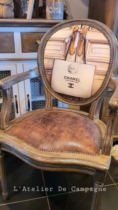 an old chair with a chanel advertisement on it's back and seat cushion