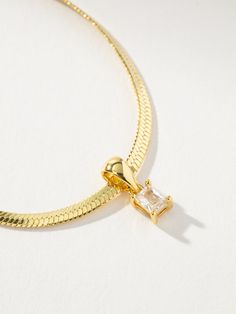 We brought together your favorite chain necklace and a stunning pendant to create the Work It Herringbone Chain Necklace. Featuring a rectangular gem pendant, this gold herringbone chain necklace is ready to shine. Wear this chain and pendant necklace on its own or layer it with your go-to everyday necklaces for an unforgettable stack. | Gold Work It Pendant and Herringbone Chain Necklace | Women's Jewelry by Uncommon James Gold Herringbone Chain, Everyday Necklaces, Uncommon James, Gem Pendant, Chain And Pendant, Herringbone Chain, Gold Work, Everyday Necklace, Work It