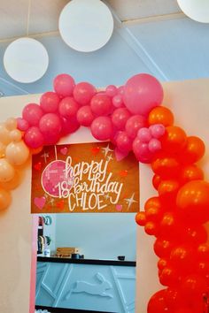 an arch made out of balloons with the words happy birthday chloe on it's side