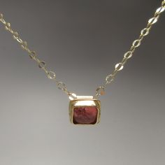 Solid gold artisan-made jewelry is something to treasure. This is a truly unique piece, designed and handmade by me in my Connecticut studio. Nothing is as luxurious as solid gold! This 14 karat gold pendant is set with one of my favorite gemstones, a tourmaline cabochon--seriously, they look like candy. The color is pink with a hint of peach which is enhanced by the gold setting. The 18 inch chain and handmade clasp are solid 14 karat gold. 14 karat gold is hypoallergenic and durable enough for Tourmaline Pendant, Tourmaline Necklace, Pink Tourmaline, Gold Pendant, Tourmaline, Solid Gold, Favorite Jewelry, Jewelry Necklace Pendant, Handmade Items