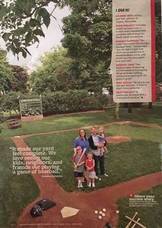 the family is posing for a photo on the baseball field