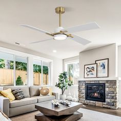 a living room filled with furniture and a fire place in the middle of a room