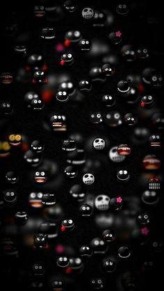 an image of many different faces on a black background with red and white lights in the middle