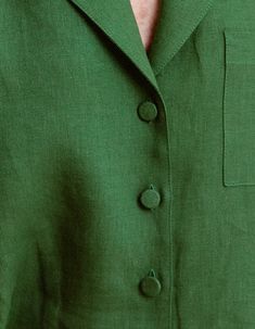 a person wearing a green suit and tie