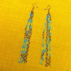 Handcrafted Beaded Gold Tone Blue Yellow Long Earrings 5.5” Long Super Fun Dangly One Of A Kind Perfect For Any Get Away Vacation Summer Festival. Can Be Customized And Made In Any Color Or Length For You Models Are Similar Earrings, Not The Same. Turquoise Beaded Earrings With Beaded Chain, Blue Round Beaded Earrings For Beach, Yellow Beaded Drop Earrings For Beach, Blue Beaded Earrings With Dangling Round Beads, Blue Earrings With Gold Beads, Blue Large Beaded Earrings For Beach, Blue Beaded Earrings For Beach, Blue Large Beads Earrings For Beach, Turquoise Beaded Chain Earrings