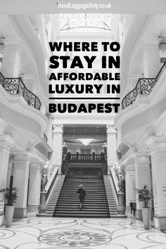 a person walking up the stairs in a hotel lobby with text overlay that reads where to stay in afordable luxury in budapest