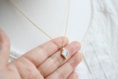 Dainty Diamond Howlite Stone necklace Great jewelry for any occasion. \ Material - Gold plated over brass, Stone \ Adjustable Chain Length - 14 ~ 20 inches \ Pendant measure - H. 14mm x W. 9mm \ The jewelry comes in a gift box ** Please check the shop policy for shipping information and jewelry care https://www.etsy.com/shop/Brillants/policy?ref=shopinfo_policies_leftnav Hexagon Necklace, Howlite Stone, Geometric Necklace, White Stone, Black Stone, Hook Earrings, Gift Wedding, Wedding Necklace, Bridesmaid Gift