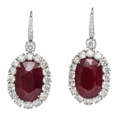 Spectacular Ruby and Diamond earrings!! 33.61 carats of impressive Ruby drops set with 10.06 carats of white round brilliant cut diamonds. Set in 18k white gold Natural rubies of this size and color are a rare find! The rubies are only heat treated, certified by GIA. Just under 2 inches long Made in New York Ruby And Diamond Earrings, Ruby And Diamond Necklace, Diamond Dangle Earrings, Ruby Earrings, Ruby Jewelry, White Gold Earrings, Women Diamond, Pear Shaped Diamond, Diamond Drops