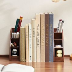 a book shelf with books and pencils on it