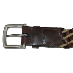 This striking and versatile 38mm braided belt adds a touch of personality and style to any casual or formal outfit. The silver-finish brass buckle stands out against the contrasting Full Grain leather lacing and cotton cord. Handcrafted in the USA with vegetable tanned leather. Made of Cotton and Leather Formal Leather Rope Belt, Classic Braided Leather Belt, Classic Leather Rope Belt, Casual Brown Belt With Brass Buckle, Casual Leather Belt With Brass Buckle, Casual Leather Belts And Suspenders, Casual Leather Rope Belt, Casual Braided Leather Belt, Casual Adjustable Leather Belt Buckles