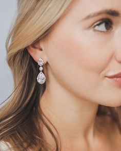 a close up of a person wearing earrings