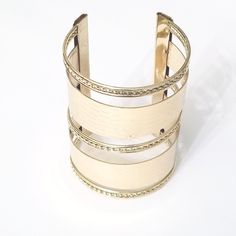 Gold cuff bracelet that features braid and crocodile detailing in the design. Elevate your monochromatic outfits with this simple addition. Material: Metal Style: Cuff Bracelet Color: Gold Chic Metal Bangle Cuff Bracelet, Chic Metal Cuff Bangle Bracelet, Trendy Metal Cuff Bracelet, Chic Adjustable Double Band Bracelet, Elegant Adjustable Band Cuff Bracelet, Trendy Adjustable Metal Cuff Bracelet, Chic Adjustable Cuff Bracelet Bangle, Chic Adjustable Cuff Bangle Bracelet, Adjustable Metal Bangle For Formal Occasions