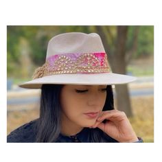 Rosa Palo Artisan Hat - Beautiful handmade hat - This beautiful rosa palo hat is the perfect statement piece for your #OOTD, for any occasion, any season! It features a gorgeous tie dye band with gold details and pom pom details on thhe back. This is the perfect hat for a girl who loves to stand out. Details & Fit - One size fits all Bohemian Pink Hat Band With Curved Brim, Pink Bohemian Hat Band With Curved Brim, Bohemian Gold Hat For Kentucky Derby, Gold Bohemian Hat For Kentucky Derby, Adjustable Pink Bohemian Fedora, Bohemian Pink Fedora With Flat Brim, Pink Bohemian Fedora With Flat Brim, Bohemian Pink Hat Band For Kentucky Derby, Bohemian Pink Hat For Festival