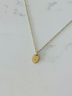 Personalized oval initial charm necklace made for everyday wear. Each item is specially hand stamped and personalized to offer a variety of meaning and love to your pieces. All materials are made of stainless steel and can be customized with a single symbol or a maximum of two characters (e.g. letters and numbers). Each charm is 13mm, and necklace lengths range from 16", 18" and 20" with the option to add an extension chain for additional length. Please message us if you have specific requests f Minimalist Personalized Charm Necklace With Oval Pendant, Minimalist Personalized Oval Pendant Charm Necklace, Minimalist Personalized Oval Necklaces, Classic Oval Charm Necklaces, Personalized Oval Link Necklace For Everyday, Minimalist Personalized Oval Necklace, Everyday Engraved Oval Pendant Charm Necklaces, Minimalist Engraved Oval Pendant Charm Necklace, Everyday Engraved Oval Pendant Charm Necklace