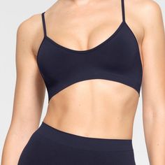 Brand New With Tags. Skims Soft Smoothing Seamless Bralette. Navy Blue Seamless Elastane Sports Bra, Blue Micro-elastic Sports Bra With Seamless Detail, Blue Seamless Micro-elastic Sports Bra, Seamless Push-up Yoga Bra, Seamless Stretch Triangle Top Sports Bra, Seamless Stretch Sports Bra With Triangle Top, Seamless Triangle Top Bra For Yoga, Seamless Triangle Top Yoga Bra, Stretch Seamless Triangle Top Bra