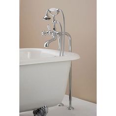 a white bath tub sitting on top of a bathroom floor