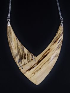 The necklace is one of a kind, handmade from Hackberry wood and has very smooth and brilliant surface. Stainless steel mesh chain 26 inch. Closure Lobster claw Care instructions: Avoid direct contact with perfumes, alcohol, water and other solvents that may damage wood finish. Wipe jewelry with soft dry cloth. Nature-inspired Natural Wood Jewelry With Variations, Nature-inspired Natural Wood Jewelry, Artisan Natural Wood Necklaces For Gift, Artisan Natural Wood Necklace As A Gift, Artisan Necklaces In Natural Wood As Gift, Artisan Necklace In Natural Wood As A Gift, Elegant Jewelry With Natural Variations For Gifts, Elegant Jewelry With Natural Variations As A Gift, Artisan Natural Wood Necklaces