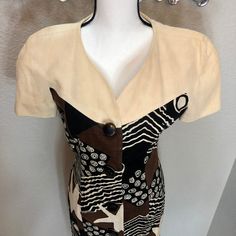 "This stunning dress is ready to strut its stuff!  It knows its value and is ready to rock the scene at work, a date, or just a girl's night out. Details: Made of 100% Linen Made in the 1990s (90s) Made in Hong Kong Size: Women's 8 Brand: Neiman Marcus Condition: Very good Dry clean only Main colors: Beige, black, brown Measurements Chest: 34\" (17\" pit to pit) Length: 37\" Waist: 30\" Disclaimer:  It is the buyer's responsibility to wash the article of clothing before wearing it.  Any mishaps that may occur due to wearing the clothing before washing it are the responsibility of the buyer and not TheGreatAdvintage.  (The shirts have been washed and cleaned beforehand, but still wash it before you wear it!) My collection consists of pieces that are of vintage condition, which means that al Early 90s, Girls Night Out, Stunning Dresses, Dress Clothes For Women, Main Colors, Knee Length Dress, Girls Night, Abstract Pattern, Neiman Marcus