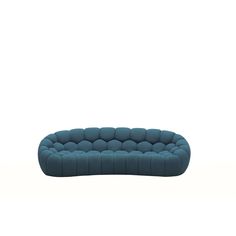 a blue couch sitting on top of a white floor