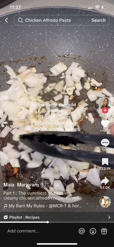 the food is being cooked in the pan on the stove with an app showing it's menu