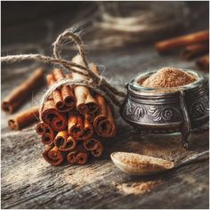 cinnamon sticks and spices on a wooden table