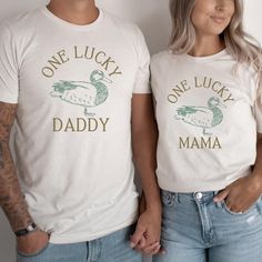 This unisex jersey short sleeve t shirt fits true to size and looks great as an oversize soft tee. This is the perfect party tee for Mom and Dad to wear to the one lucky duck birthday party or will look cute year round! This shirt is Unisex sizing and comes in 3 Bella Canvas colors, choose White, Ash or Natural to make this Lucky Mama or Daddy shirt the perfect addition to your little duck's party! Please add the personalization for your shirts in the box when ordering. DETAILS .Made from Airspun Cotton .Bella Canvas tee .Tear away label .Runs true to size .Crew Neckline .Props in any photos are not included and are for styling purposes only .Colors may slightly vary from styled photos  SIZING This graphic tee design will be printed on a Bella Canvas shirt that is high quality, comfortable One Lucky Duck Photoshoot, Lucky Duck Birthday, One Lucky Duck, One Lucky Duck Birthday Party, One Lucky Duck Birthday Invitation, Duck Shirt, Duck Birthday, Lucky Duck, Bella Canvas Tees