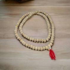 Tulsi Mala necklace, 108+1 Premium beads in Hand Knotted Mala Tulsi beads are made from Tulsi (Holy Basil) plant wood, considered as most sacred in India. Tulsi plant is worshipped in India and the food offered to Indian Gods is incomplete without the offereing of Tulsi leaves along with it. Tulsi Mala provides protection to the wearer and is said to maintain Health, provide Peace of Mind and reduce Stress. They are used to worship Lord Krishna to honour him and to get his blessings. Traditional Gemstone Beads Rosary For Meditation, Traditional White Necklace For Healing, Traditional Natural Color Hand-strung Necklace, White Wooden Beads Jewelry For Meditation, White Wooden Beads Necklace For Meditation, Traditional Necklaces With 8mm Beads For Rituals, White Wooden Beaded Jewelry For Meditation, Ritual Amulet Mala With 8mm Beads, Spiritual Necklace With 108 Natural Beads