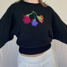 The coolest 80s does 50s knit batwing sweater! Black with bright colorful floral design on the front. Feels like acrylic. Fits tight at wrist and waist but material has stretch to it, rest is an open, loose fit. Please review measurements. Chest: open size Length: 20.5in Waist: 24-34in Batwing Sleeve Sweater, Batwing Sweater, Black Knit Sweater, Floral Sweater, Floral Knit, Sweater Vintage, Pullover Sweater Women, Floral Vintage, Batwing Sleeve