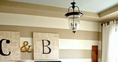 a living room with striped walls and furniture