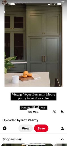 an image of a kitchen with green cupboards and white counter tops on the phone