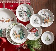 christmas dinnerware is displayed on a table