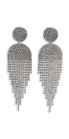 The Button Post Graduated Rhinestone Earrings feature rhinestone buttons with tassle-like dangle and back post closures. Wear these earrings adorningly to your next wedding, or formal evening event! Metal Tassel Earrings For Wedding, Wedding Tassel Drop Earrings With Rhinestones, Elegant Metal Earrings With Rhinestone Fringe, Glamorous Rhinestone Tassel Earrings For Wedding, Rhinestone Fringe Drop Earrings For Wedding, Wedding Rhinestone Fringe Drop Earrings, Silver Tassel Earrings With Rhinestones For Evening, Wedding Drop Earrings With Rhinestone Fringe, Glamorous Silver Tassel Earrings With Rhinestones