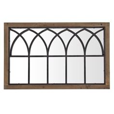 an old window with arched glass and wooden frame