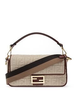 Beige and brown ‘Baguette’ shoulder bag from Fendi. Crafted from canvas with jacquard FF motif, this design fastens via magnetic snap-button and employs leather trims, gold-tone metal hardware including logo plaque on the front, a detachable and adjustable shoulder strap and interior with one compartment and one zip pocket. Size: Medium Country of Origin: Italy Fendi Baguette Bag, Fendi Purses, Tods Bag, Compact Bag, Baguette Bag, Suede Fabric, Fendi Baguette, Fendi Bags, Wine Red