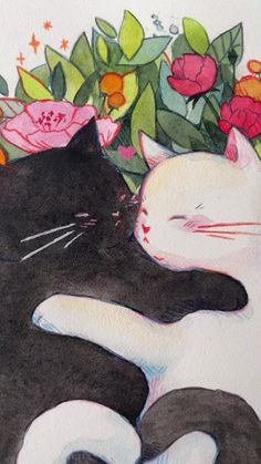 two black and white cats laying next to each other on top of a bed of flowers