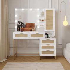 a white vanity with lights on it in a room next to a bed and chair