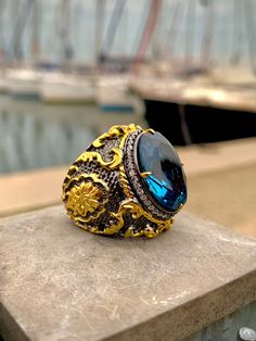 24 K Gold Plated Victorian Ring Ornate Ring Blue Topaz Gemstones Rococo Style Men Ring Handmade Ring Topaz Men  Ring PRODUCT DETAILS * Made to Order * Certified 925 sterling silver * Your ring comes in a pretty ring box ready for gift giving. RING SIZE *It is always safer to see a jeweler to have a more precise idea about your ring size. However, if it is not possible please look at our ring size chart in the pictures. There you can also find the size conversions. *If your ring size is not in th Handmade Luxury Topaz Ring For Anniversary, Luxury Handmade Topaz Ring For Anniversary, Handmade Luxury Topaz Anniversary Ring, Luxury Handmade Topaz Ring, Handmade Luxury Crystal Ring For Formal Occasions, Unique Topaz Rings With Gemstone Accents, Elegant Topaz Rings With Stones, Blue Topaz Rings With Stones, Topaz Stone Ring Gift