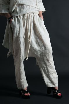 Linen Harem Pants, Wide linen pants, Natural Linen Pants. Harem Linen Pants with elastic waist and tie rope. SIZE & FIT: *Our Model is 5′6″ / 175 cm and wears size M. *Available Sizes: form XS up to 8XL *This product could be customized according to your measurements. *Please leave your requirements in the checkout. CARE Dry Cleaning Machine Wash 30oC Hand Wash with warm water Medium hot iron Time to ship & DELIVERY : Your piece will be ready to ship in 5-6 biz days upon placing your ord Bohemian Drawstring Trousers, White Drawstring Bottoms Loosely Fitted Hips, White Bottoms With Drawstring And Loosely Fitted Hips, Bohemian White Drawstring Bottoms, Bohemian Wide-leg Pants With Drawstring, Bohemian Wide-leg Drawstring Pants, White Bohemian Bottoms With Drawstring, Beige Relaxed Fit Pants With Drawstring, Beige Linen Pants With Drawstring