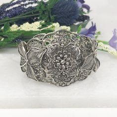 One of a Kind Handmade 925 Sterling Silver Artisan Crafted Filigree Adjustable Floral Cuff Bracelet Material: 925 Solid Sterling Silver, 925 Stamped Cuff Bracelet Weight: 35 Grams Bracelet Length: Adjustable to fit wrists 7 inches to 8.5 inches Bracelet Width: 1.60 inches Finishing: Oxidized & Polished Comes with a gift pouch and box Free Domestic Shipping Antique Silver Sterling Silver Bracelet With Intricate Design, Bohemian Sterling Silver Bracelet As Gift, Antique Silver Sterling Silver Bracelets With Intricate Design, Silver 925 Stamped Cuff Bracelet As A Gift, Handmade Antique Silver Cuff Bracelet For Wedding, Sterling Silver Bracelets For Ceremonial Occasions, Handmade Silver Cuff Bracelet As Gift, Unique Antique Silver Sterling Silver Bracelet For Gift, Bohemian Sterling Silver Cuff Bracelet For Gift