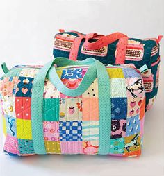 two colorful bags sitting next to each other on top of a white surface with one bag in the shape of a patchwork quilt