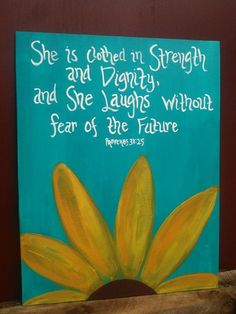 a painting with the words she is clothed in strength and beauty