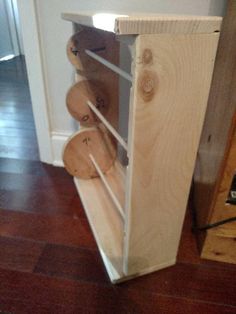 a wooden shelf with several pieces of wood on it