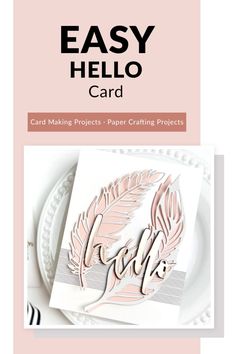 a card with the words easy hello on it and some paper crafting supplies in front of